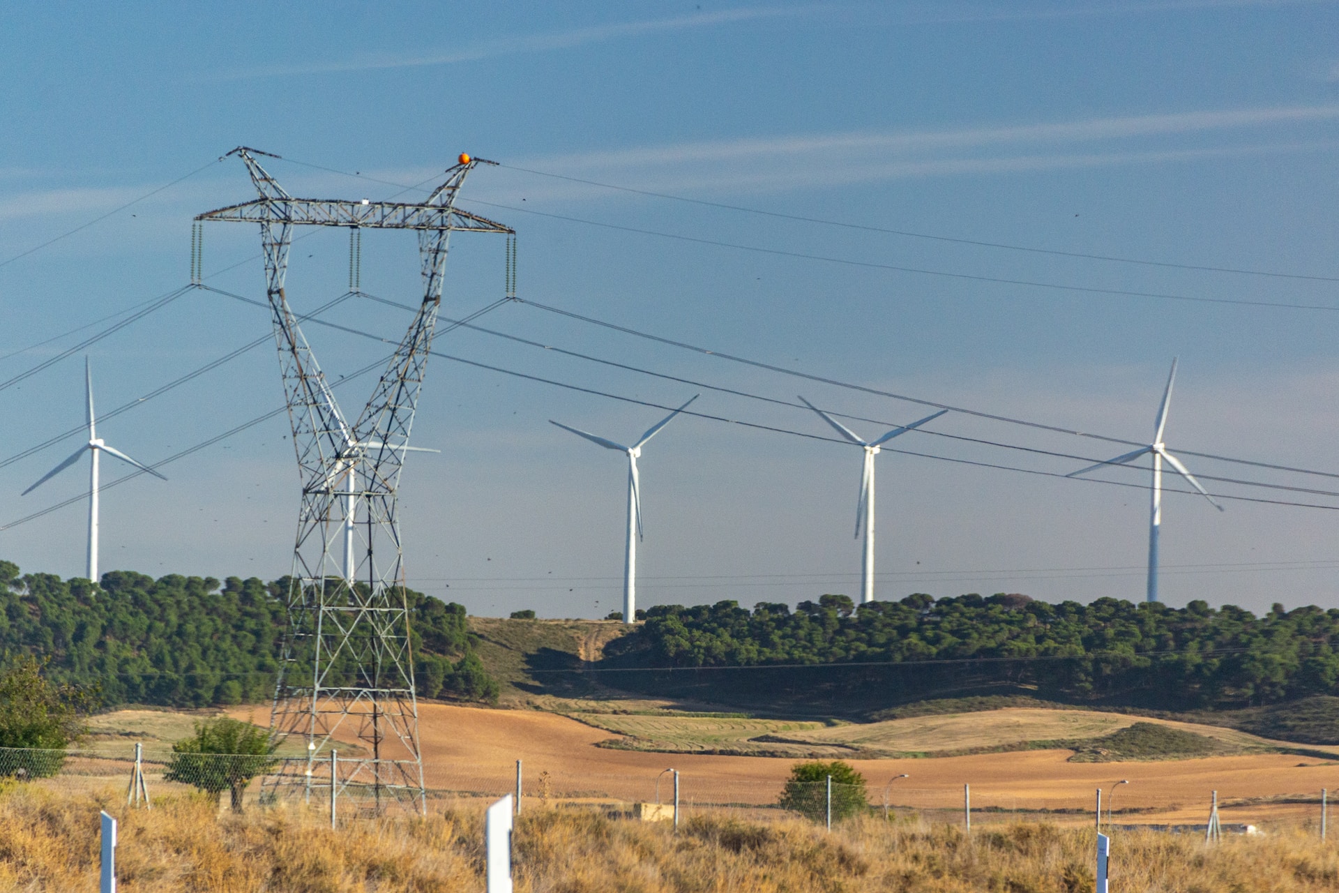 electricity and wind turbines in a field